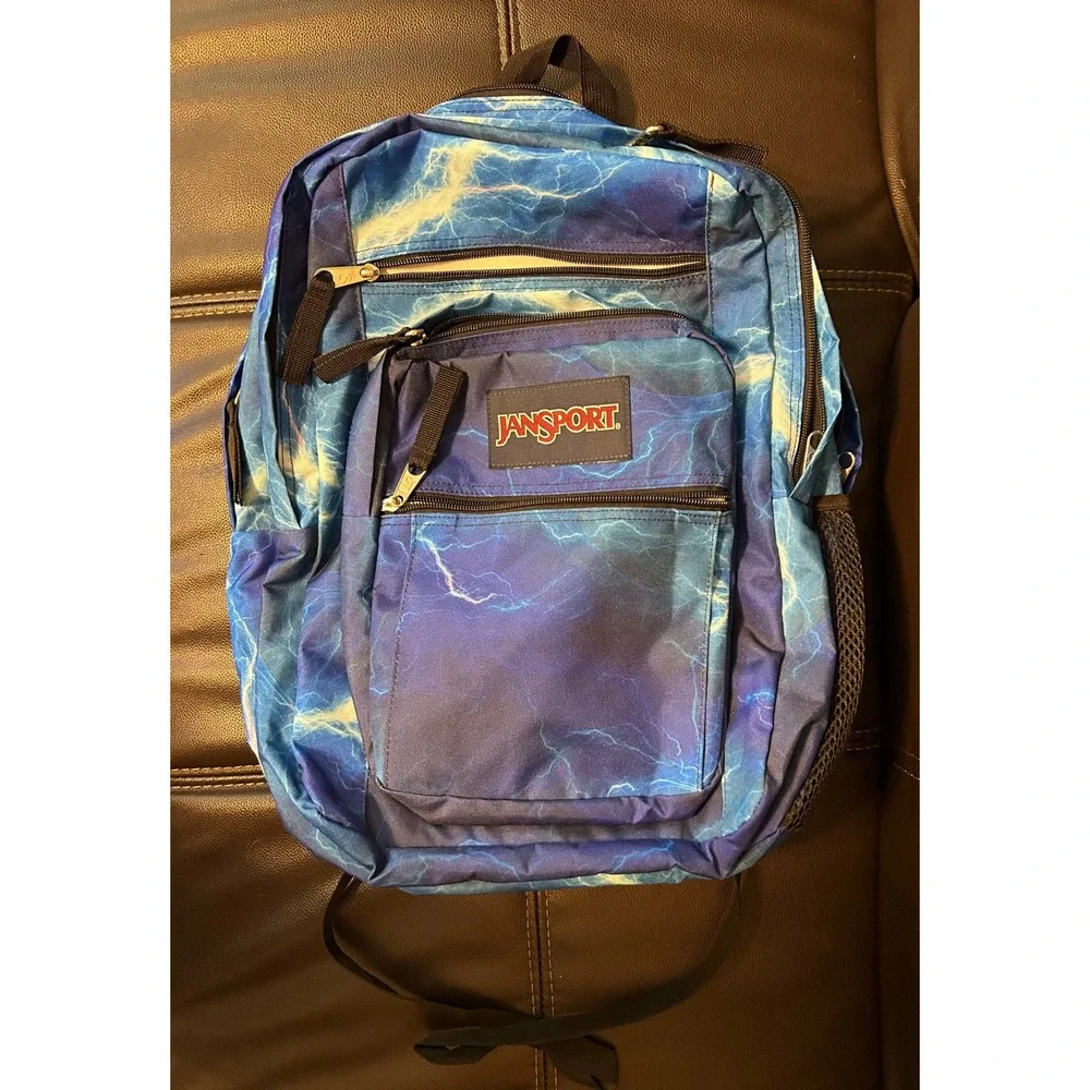 NWOT JanSport Back Pack, Blue Lightening. Multi Zip Pockets
